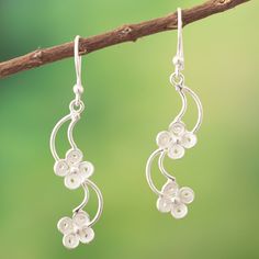 Luminous curved formations create a unique illusion in these dangle earrings by Peruvian artisan Alfredo Inga. After making the floral motifs, the artisan joins every element, made from sterling silver, to create accessories that resemble blooms carried by the wind, making an elegant complement to any outfit. Artistic Sterling Silver Earrings, Filigree Hoop Earrings, Filigree Earrings, Silver Dangle Earrings, Sterling Silver Dangle Earrings, Lovely Earrings, Silver Filigree, Metal Earrings, Floral Motifs