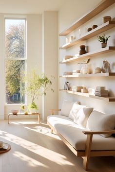 a living room filled with lots of white furniture