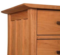 a wooden dresser with two drawers on each side