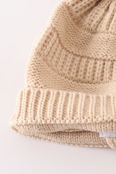 Stay warm and stylish with our Beige Pompom Cable Beanie! The perfect accessory to complete any cozy look, this beanie features a chic beige color and playful pompom. With its cable knit design, it provides both warmth and charm. Say goodbye to boring headwear and hello to this quirky beanie! 100%Acrylic Kids: 17.5*18cmAdult: 20*20.5cm HAT-052 Beige Soft Knit Crochet Hat For Winter, Beige Knit Beanie, Beige Knitted Beanie, Beige Soft Knit Crochet Hat For Fall, Cream Soft Knit Crochet Hat For Winter, Winter Cream Crochet Hat With Soft Knit, Cream Crochet Winter Hat With Soft Knit, Cozy Beige Crochet Knit Hat, Beige Soft Knit Hat