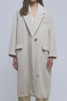 This oversized long coat is made with a heavyweight material to keep you warm and features a tortoise swirl button. The style is completed with a large lapel collar and drop shoulders. Oversized fit Drop shoulder Long sleeves Large notch lapel Lined front pockets Single button closure Features tortoise swirl button Midi length Lined Hand wash cold Do not bleach Do not tumble dry Iron low Shell: 100% Polyester Lining: 100% Polyester JJ1813J Total length: 44.50" Bust: 48" S BEIGE, CAMEL: Height 5' Elegant Neutral Outerwear With Relaxed Fit, Classic Oversized Outerwear For Everyday, Classic Oversized Single Breasted Outerwear, Elegant Relaxed Fit Outerwear With Button Cuffs, Classic Oversized Single-breasted Outerwear, Oversized Single Button Outerwear, Classic Oversized Outerwear With Double Button Closure, Elegant Outerwear With Lapel Collar In Relaxed Fit, Modern Oversized Outerwear For Everyday