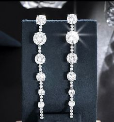 New to our Bella CollectionAnother beauty, glamorous simple, elegant and beautiful long drop swarovski crystal earrings. approx 3 1/2 " long pierced--------------------------------------------(add elegant classic tennis bracelet at discounted price) *Note processing time is not shipping time, our regular Free shipping takes approx. 5-6 days to receive after shipped. With rush processing your order is expedited and you will also be upgraded to priority mail approx 2-3 days to arrive once shipped Bridal Earrings Drop, Long Drop Earrings, Swarovski Crystal Earrings, Crystal Drop Earrings, Crystal Drop, Tennis Bracelet, Bridal Earrings, Bridal Style, Crystal Earrings