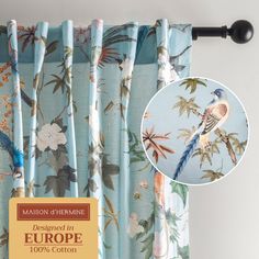 the curtains are designed in europe with birds and flowers printed on them, along with a black rod