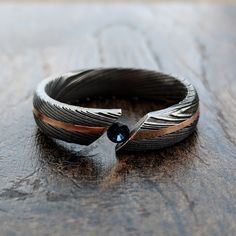 a close up of a ring on a wooden surface