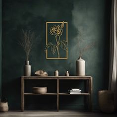 a living room with green walls and vases on the side table in front of it