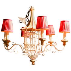 a chandelier with red shades on it