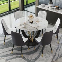 a marble dining table surrounded by white chairs