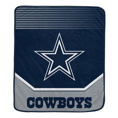 a blanket with the word cowboys written on it and a star in the center, against a white background