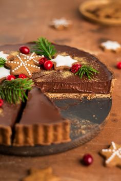 a chocolate tart decorated with christmas decorations