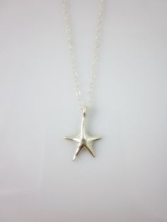 A sterling silver star charm hangs on a dainty sterling silver chain and closes with spring clasp. Simple and chic everyday jewelry. Charm measures: 16 x 10 mm Total length of necklace : 17 inches All components are sterling silver. All items are shipped in a gift box via registered mail. Thanks for looking. Please have a look at more items in the shop: http://smoketabby.etsy.com Star-shaped Sterling Silver Jewelry With Lobster Clasp, Sterling Silver Starfish Charm Necklace, Minimalist Starfish Charm Jewelry, Sterling Silver Star Charm Necklace Nickel Free, Sterling Silver Starfish Necklace With Star Charm, Nickel-free Sterling Silver Star Charm Necklace, Sterling Silver Star Charm Necklace For Everyday, Sterling Silver Necklace With Starfish Charm, Everyday Sterling Silver Star Charm Necklace