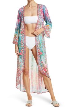 Unleash your free boho spirit in this longline duster styled with vivid allover blooms and airy flare sleeves. V-neckline Flare sleeves All-over pattern Woven 100% polyester Hand wash cold, line dry Imported Model stats: 5'10", 32" bust, 25" waist, 36" hip. Model is wearing size One Size. V-neck Floral Print Festival Cover-up, Bohemian V-neck Cover-up With Floral Print, Bohemian V-neck Floral Print Cover-up, Flowy Bohemian Unlined Cover-up, Bohemian Flowy Unlined Cover-up, Spring V-neck Beachwear Kimono, Long Hippie Kimono For Spring, Long Cover-up For Spring Festivals, Spring Long Beachwear Cover-up