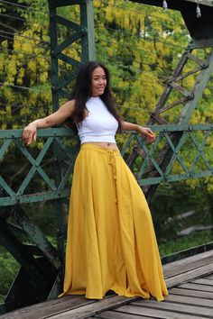 All items are shipped Thailand Post.Free upgrade when you buy 2 items to D.H.L express.The USA only. Please leave a phone number with orders. US sizing fits XS - L please check the sizes in inches in the description. The skirt comes with the free yellow top as pictured bust 30'' inches to 38'' inches Full-length skirt in Organic Hemp and Cotton Mix. Three-quarters elastic waist with drawstring ensuring a great fit and half lined.Decorative button running from the center waist to the hemline that Yellow Long Skirt, Long Yellow Skirt, Yellow Maxi Skirt, Yellow Skirt Outfit, Bohemian Skirts Long, Yellow Skirt Outfits, Yellow Maxi Skirts, Skirt With Buttons, Maxi Skirt Boho