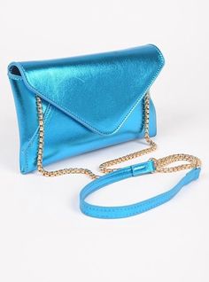 Metallic Envelope Clutch Swing Bag. Elegant Blue Flap Bag For Evening, Elegant Blue Evening Flap Bag, Blue Rectangular Flap Bag For Formal Occasions, Blue Shoulder Flap Bag With Magnetic Closure, Formal Blue Rectangular Flap Bag, Elegant Blue Flap Bag With Magnetic Closure, Blue Evening Flap Bag With Removable Pouch, Blue Flap Bag With Removable Pouch For Formal Occasions, Elegant Blue Satchel With Mobile Phone Bag