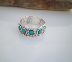 *Metal Purity:   925 Sterling Silver (tested) *Gemstone:Blue Turquoise  *Gem Size:3mm each stone *Ring Size: 6.5 *Band Width:6.8mm  *Weight:1.8 grams   *Marking:925 ∣ Taxco ∣ Mexico ∣ Eagle 3 symbol Sterling ∣ HS *Condition:This beautiful condition for the age with no missing stones. Does show signs of usage, but nothing major.  Please keep in mind these items are either antiques or vintage, not brand new and might show some wear, but if there's anything major I will list it under the condition section.  Please carefully review all images as they are a part of the description and if you have any questions, please don't hesitate to ask before making a purchase.  Please Visit My Store For More Great Finds https://www.etsy.com/shop/KristinCarolVintage Hallmarked Turquoise Sterling Silver Ring For Anniversary, Anniversary Hallmarked Turquoise Sterling Silver Ring, Anniversary Sterling Silver Multi-stone Turquoise Ring, Anniversary Turquoise Multi-stone Ring In Sterling Silver, Anniversary Turquoise Multi-stone Sterling Silver Ring, Anniversary Multi-stone Turquoise Ring In Sterling Silver, Bohemian Hallmarked Turquoise Ring For Anniversary, 3 Symbol, Mexico Eagle