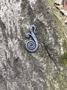 a metal object on the side of a rock