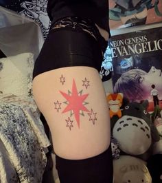 a woman's thigh with stars on it