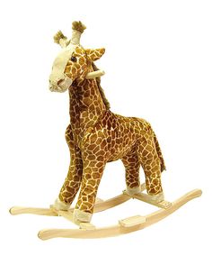 a toy giraffe standing on top of a wooden rocking horse with long legs