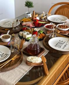 the table is set with plates, cups and saucers for an appetizer