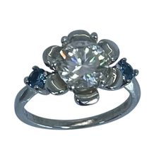 The center store of this ring is lab created moissanite, 7 mm, round shape, v s, clarity, 1.10 carats.  The stones on the sides are 2 natural blue topaz, 3 mm, round, 0.15 carats.  The ring is made in 14k solid gold.  The ring is available in white, yellow and rose gold.  The size of the ring is 7.75.  I offer free professional resize to any size.  Please just confirm the color of the gold and the size that you need.  This is hand crafted ring. Moissanite Topaz Ring With Round Cut Accent Stones, White Topaz Ring With Center Stone, Dec 12, Topaz Ring, Round Shape, Blue Topaz, Wedding Engagement, Dream Closet, Solid Gold