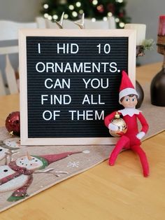 an elf sitting next to a sign that says i hid 10 ornaments can you find all of them