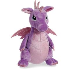 a purple dragon stuffed animal sitting on top of a white surface