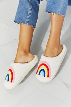 Start off your day the perfect way, with these rainbow-graphic slippers (and a cup of coffee). Soft and fuzzy on the inside and the outside, these slippers will keep you warm and cozy whether you're working from home or getting ready for a good night's rest. Size fit: True to size Pattern type: Graphic Type: Slippers Toe: Round toe Heel height: Flats Heel shape: Flats Material: Faux fur top/rubber sole Imported MMShoes has made a name for itself in European and Asian markets through footwear tra Rainbow Plush, Faux Fur Top, God Natt, Rainbow Graphic, Fur Top, Comfy Slippers, Slippers Cozy, Teddy Bear Plush, High Quality Shoes