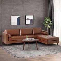 a living room with a brown leather couch and coffee table