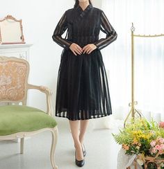 This is a Korean Modern Hanbok Dress for Women.It is Wrap Style Dress in Black color.This hanbok is modernly designed so you can wear it comfortably and beautifully.This modern hanbok is perfect dress for daily and special celebrations such as parties or various events.⭐You can create a variety of styles by layering skirts of different colors on this dress. Go look Modern Hanbok Skirts:https://www.etsy.com/shop/LunarJogak?ref=seller-platform-mcnav&section_id=33459396⭐Decorate more stylishly Sheer Long Sleeve Organza Dress, Black Organza Long Sleeve Dress, Elegant Fitted Long Sleeve Hanbok, Layering Skirts, Hanbok Women, Modern Hanbok Dress, Hanbok Dress, Dress Korea, Modern Hanbok