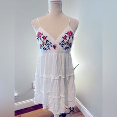 Summer Dress By Francesca Sz L White Linen With Embroidered Flowers. Never Worn Embroidered Mini Dress For Summer, Fitted Embroidered Summer Dress For Brunch, Fitted Embroidered Dress For Summer Brunch, Spring Sleeveless Sundress With Floral Embroidery, Floral Embroidered Sleeveless Sundress For Spring, Spring Floral Embroidered Sleeveless Sundress, Summer Vacation Embroidered Midi Dress, Summer Embroidered Mini Dress, Summer Midi Dress With Floral Embroidery For Beach