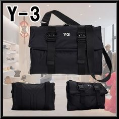 the y - 3 bag is black and has three different compartments for it to carry