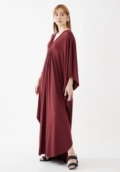 "🚚..ALL ORDERS ARE SHIPPED VIA DHL EXPRESS MAIL This soft red caftan dress is a great timeless wardrobe essential that you should not miss. Great for all shapes and sizes. * Pullover style * Deep v neck * Ruched detail at front with weaving rope strips * Batwing sleeves * Relaxed fit * For a slouchy silhouette * Unlined Measurements approximately: Sleeve Length (from side of neckline): 25\" (63.5 cm) Sleeve cuff: 18\" (46 cm)-round Bust: 66\" (168 cm)-all around. Hips: 60\" (152 cm)-all around. Red Flowy V-neck Kaftan, Elegant Maxi Length Kaftan For Loungewear, Red Flowy Dress With Kimono Sleeves, Red Free Size Long Maxi Dress, Flowy Red V-neck Kaftan, Red Free Size Maxi Dress, Red Bohemian Loungewear Dress, Flowy Red Maxi Kaftan, Red Maxi Kaftan For Beach Cover-up