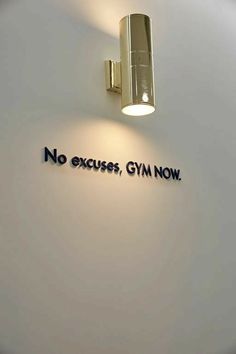 there is a sign on the wall that says no excuss, gym now