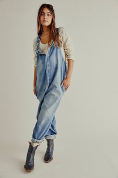 So cool and slouchy, these go-with-anything overalls are featured in a classic silhouette with balloon-style legs and adjustable shoulder straps for a forever flattering fit. * Smocked elastic waist at back* Four pocket style * Slouchy, relaxed fit Spring Overalls With Slip Pockets And Relaxed Fit, Casual Relaxed Fit Jumpsuits With Slip Pockets, Casual Denim Blue Overalls With Adjustable Straps, Casual Washed Overalls With Bib Front, Casual Washed Bib Front Overalls, Casual Denim Jumpsuit With Adjustable Straps, Relaxed Fit Everyday Overalls And Rompers, Casual Everyday Overalls With Bib Front, Relaxed Fit Everyday Overalls And Jumpsuits