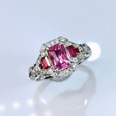 At our establishment, we take pride in guaranteeing the authenticity of every gemstone. Each piece of jewelry features natural stones sourced from the world's most renowned regions. Our rubies are procured from Mozambique and Sri Lanka, while our sapphires are exclusively from Sri Lanka. Our emeralds are sourced from Zambia and Colombia, with tourmalines and amethysts originating from Brazil. Additionally, our opals are from Australia and Ethiopia. Rest assured, all our gold is of the highest ca Gia Certified Emerald Cut Ruby Ring In White Gold, Fine Jewelry Emerald Cut Pink Sapphire Ring, Emerald Cut Pink Sapphire Ring In Fine Jewelry Style, Wedding Ruby Ring, Gia Certified, Emerald Cut, Formal Emerald-cut Ruby Ring With Three Stones, Formal Three Stone Emerald Cut Ruby Ring, Formal Emerald Cut Three-stone Ruby Ring, Pink Sapphire Emerald Cut Ring For Anniversary, Emerald Cut Pink Sapphire Ring For Anniversary