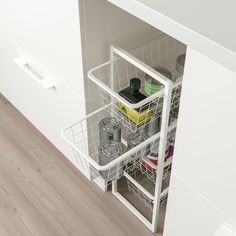 a kitchen cabinet with two baskets on the bottom