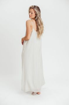 She's charming, she's flattering, and she's the first dress you'll reach for as temps start to warm and the sun comes out to play. Pair the Deacon Maxi Dress with a cropped denim jacket and boots, or pack her in your suitcase for your next tropical vacay! You'll love having this versatile and comfortable dress ready to go at a moment's notice. FIT: Runs true to size. MODEL: Model is 5’7” / wearing a small. MATERIAL: Self: 68% Rayon, 32% Nylon; Lining: 95% Polyester, 5% Spandex. GARMENT DETAILS: Sleeveless shift dress in a maxi length. Features adjustable spaghetti straps, with a V-neckline and in-seam pockets. SIZE GUIDE: S (2-4) / M (6-8) / L (10-12) Midi Tank Dress, Sleeveless Shift Dress, Cropped Denim Jacket, Maxi Tank Dress, Comfortable Dress, Cropped Denim, Tank Dress, Shift Dress, To Play