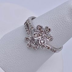 Up For Sale Absolutely Beautiful 14k White Gold 0.5ct Genuine Diamond Flower Design Band Ring. Metal Purity: 14k Hallmark: 14k Metal Weight: 2.7 Grams Diamond Weight: Total 0.50ct (0.02pts/0.015pts) Diamond Color : I Clarity: Si2- I1 Super Sparkle And Eye Clean Stone Size : 7 .One Size Up Or Down Is Doable At Your Own Cost Condition : Pre Owned .Polished .Like New Gift Box Is Included Please Review The Pictures And Get Back To Me With Any Questions You May Have Thanks Flower Shaped Diamond White Ring With Diamond Accents, Diamond White Flower-shaped Ring With Diamond Accents, White Gold Diamond Ring With Flower Accents, White Gold Diamond Ring With Flower Shape, White Diamond Flower-shaped Ring With Accents, Diamond White Flower Shaped Diamond Ring, Solitaire Diamond Flower Ring In Fine Jewelry, White Gold Solitaire Diamond Flower Ring, White Diamond Flower Ring With Diamond Cut