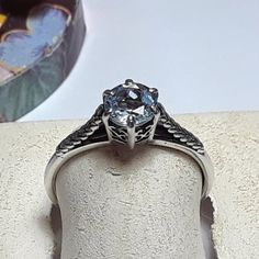 This Simple Classy Solitaire Ring Features A 6.0mm (Aprox .75ct) Round Natural White Topaz, Set In A Fancy Scroll Top With Feathered Raised Sides. The Ring Measures Aprox 1/4" In Width And Weighs Aprox 1.810 Grams Of Solid (Stamped 925 Inside The Shank) Sterling Silver. This Simple Classy White Topaz Solitaire Ring Has A Msrp Of $289.00. Finger Size 8 (This Ring Can Be Sized By Your Local Jeweler, At Your Cost, We Do Not Size, Sorry) White Topaz, Womens Jewelry Rings, Solitaire Ring, Blue And Silver, Topaz, Women Jewelry, Sterling Silver, Ring, Silver