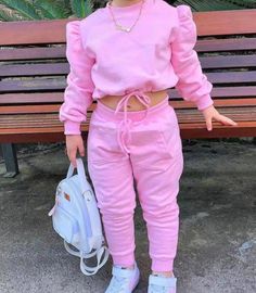 Adorable pink jogger outfit for children, a delightful ensemble designed to bring comfort and style to your little one's wardrobe. This charming set features a soft pink top adorned with a practical drawstring, allowing for a customizable fit. The jogger pants are just as delightful, ensuring unrestricted movement during playtime or outdoor adventures. Available in seven different sizes. Pink Drawstring Sweatpants For Loungewear, Pink Drawstring Casual Joggers, Pink Casual Joggers With Drawstring, Playful Cotton Joggers For Loungewear, Trendy Pink Sweatpants With Drawstring, Casual Pink Cotton Joggers, Pink Cotton Trendy Joggers, Trendy Pink Cotton Joggers, Pink Cotton Joggers For Spring