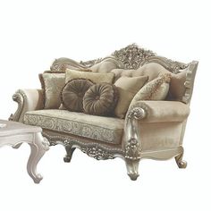 an ornate couch with pillows on top of it