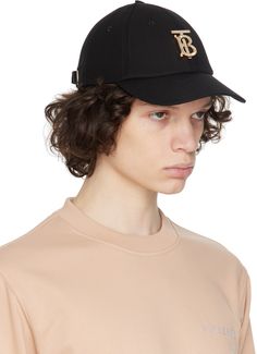 Cotton twill cap in black. Crystal-cut logo plaque at face. · Curved brim · Embroidered eyelets at crown · Cinch fastening at back face · Grosgrain browband · Logo-engraved silver-tone hardware Supplier color: Black Classic Flat Brim Baseball Cap With Logo, Classic Logo Baseball Cap With Flat Brim, Luxury Flat Brim Baseball Cap With Embroidered Logo, Luxury Baseball Cap With Embroidered Logo And Visor, Luxury Baseball Cap With Curved Brim And Logo, Luxury Baseball Cap With Embroidered Logo And Flat Brim, Luxury Baseball Cap With Embroidered Logo, Luxury Logo Baseball Cap With Curved Brim, Classic Hats With Logo Detail And Curved Visor