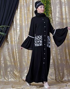 Easy to wear and handle Partywear abaya Classy and elegant Executive formal Abaya Elegant and trendy kaftan for every occasion Loose and elegant trendy fit to all Premium Shine Nida Fabric with rich look Hijab and band shown in the image can be bought separately Fabric: 100% Polyester Crepe ( Matt Finished Nida)Care: Mild machine wash/ hand Cold Wash/ Dry cleanWe request customers to carefully choose the correct size and dress length referring to our size chart Black Abaya With Dabka Work, Black Floor-length Abaya With Dabka Work, Modest Black Kaftan For Eid, Black Embroidered Floor-length Abaya, Long Abaya With Dabka Work, Black Long Sleeve Hijab For Eid, Black Abaya With Dabka Work For Eid, Black Long Sleeve Khimar With Dabka, Elegant Black Agbada For Eid