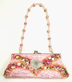 This cool purse is fully sequin beaded front & back tip to tip. Perfect for pairing up with your costume or to carry with you in event! Evening Bags With Sequins For Party Season, Party Clutch Bag With Sequins, Party Clutch With Sequins, Sequined Party Clutch Bag, Pink Rhinestone Clutch For Evening, Multicolor Rhinestone Evening Bag For Party, Handheld Sequins Party Bag, Glamorous Multicolor Party Bags, Pink Rectangular Evening Bag For Night Out