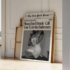 an advertisement for the new york times in front of a wall with a photo of a woman