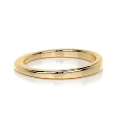 a gold wedding ring on a white background