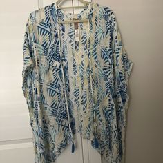 Beautiful Poncho/Blouse Of Beautiful Print From Cico’s Size Small-Medium. Perfect Tip To Pair With Jeans, Leggings Or Skirt. It’s Floaty, Airy And So Lightweight Material With Little Tassels At The Bottom. You Will Love To Wear This Top And Will Surely Get A Lot Of Compliments!!! One Size Long Sleeve Beach Cover-up Top, Casual Poncho For Vacation, Long Sleeve Poncho For Spring Vacation, Casual Poncho For Spring Loungewear, Casual Spring Poncho For Loungewear, Blue One-size Beachwear Cover-up, Blue One Size Beachwear Cover-up, Casual One-size Poncho For Vacation, Casual One Size Poncho For Vacation