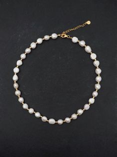 This classic necklace, with its lustrous pearls, has the power to elevate even the simplest white tank top into a sophisticated ensemble. Its versatility is unmatched, effortlessly transitioning from casual daywear to elegant evening attire. Natural Baroque Pearls + 18K Gold Plated on Sterling Silver. Length: 16 inches + 2 inches extender. Pearl size: 10-12mm. Classic Necklace, Silver Shop, Pearl Size, Evening Attire, White Tank Top, Baroque Pearls, White Tank, Earring Necklace, Ring Necklace