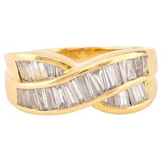 Center Stone: 29 Baguette Cut Diamonds Weight: 1.20 Carats Color: G-H Clarity: I1 Metal: 18K Yellow Gold Era: Vintage Circa: 1990's Hallmarks: Stone Weight Engraved and Purity Mark Size: 7 and can be resized Gram weight: 6.9 This elegant vintage band, crafted in 18K yellow gold, features 29 stunning baguette cut diamonds totaling 1.20 carats. The diamonds, graded G-H in color and I1 in clarity, create a dazzling, seamless design that wraps around the band, exuding sophistication and brilliance. Hallmarked with the stone weight engraved and purity mark, this timeless piece from the 1990s weighs 6.9 grams and is sized at 7. The classic and refined design makes it a perfect addition to any jewelry collection, ideal for those who appreciate understated luxury. Memory Ring, Yellow Gold Cocktail Ring, Unique Rings Vintage, Platinum Diamond Engagement Rings, Fancy Yellow Diamond, Platinum Diamond Rings, Gold Cocktail Ring, Baguette Cut Diamond, Wedding Mood