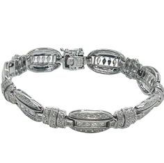 This exquisite bracelet features square diamonds surrounded by brilliant cut diamonds set in 18k white gold. 116 total diamonds VS-SI Clarity G-H Color Weight: 22.8 grams, 14.7 dwt  Size: 6.75" long This is a vintage piece and consequently gold may test below stated carat. In VERY GOOD Condition L4-1 Diamond White Platinum Bracelet With Baguette Diamonds, Platinum Diamond Bracelet With Baguette Diamonds In Diamond White, Rectangular Diamond Tennis Bracelet With Accents, Anniversary Diamond Bracelet With Baguette Diamonds, Elegant Diamond Tennis Bracelet With Rectangular Shape, White Gold Diamond Bracelet With Baguette Cut, White Gold Bracelet With Baguette Diamonds, Luxury Rectangular Brilliant Cut Diamond Bracelet, White Gold Baguette Cut Diamond Bracelet