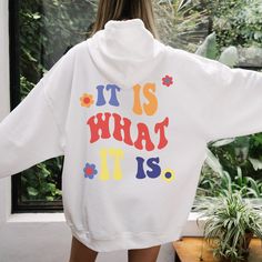 Daily Positivity: It Is What It Is ★ HOW TO ORDER ★ 1. Select the type: Hoodie or Sweatshirt 2. Select the size 3. Select the quantity 4. Add to cart ★ HOODIE & SWEATSHIRT DETAILS ★ * 50% Cotton 50% Polyester * Classic fit - runs true to size * Made-to-order * Digitally printed design (DTG) Slight color variations may occur due to the dyeing process Order a size or two up for an oversized tee fit Shop exclusive designs made by She's Gold Co. Lifestyle brand that aspires to empower and inspire wo White Hooded Top With Screen Print, Retro White Hoodie With Graphic Print, White Hoodie With Screen Print, White Screen Print Hoodie, White Retro Hooded Sweatshirt, Retro White Hooded Sweatshirt, White Text Print Hoodie, White Text Print Hoodie Tops, White Hoodie With Lettering In Relaxed Fit